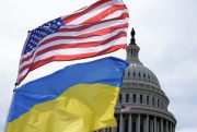 The American and Ukrainian flags wave.