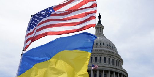 The American and Ukrainian flags wave.