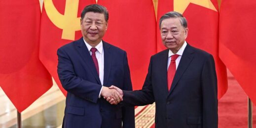Chinese President Xi Jinping shakes hands with Vietnamese Communist Party General Secretary To Lam.