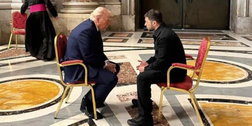 U.S. President Donald Trump talks with Ukrainian President Volodymyr Zelenskyy.