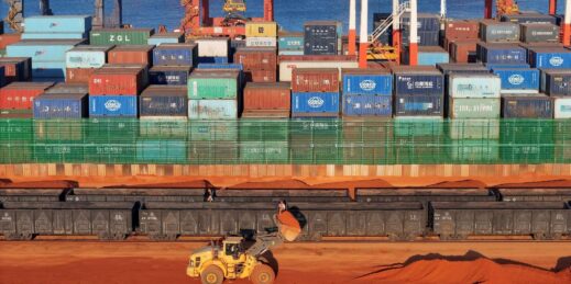 An excavator loads a train with bauxite, a source of the rare earth metal gallium, in Yantai, China.