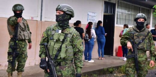 Soldiers guard a polling station in the presidential election in Canuto, Ecuador.