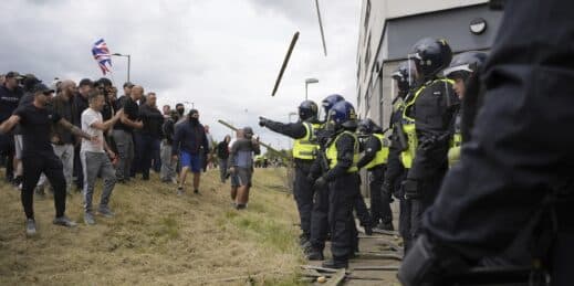 Protestors and police face off.
